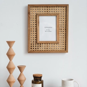 Minimalist Japanese solid wood and rattan 5x7 inch rectangular photo frame hanging on wall