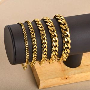 Polished gold-plated stainless steel Cuban bracelets in five different width sizes