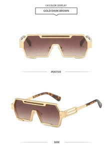Detail view of gold futuristic punk sunglasses with dark brown gradient lenses and tortoise tips