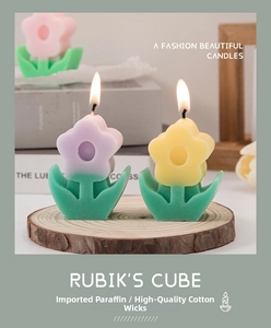 Detailed view of flower-shaped aromatherapy candles on a rustic wooden base for home decor