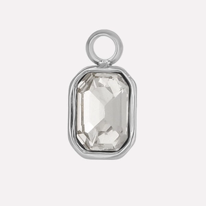 Detailed macro of a rectangular glass stone pendant with a silver stainless steel frame