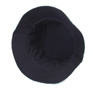 Detail shot of black cotton lining and precise stitching on a reversible sun bucket hat