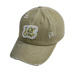 Close-up of distressed cotton baseball cap with embroidered I do Crew patch and diamond
