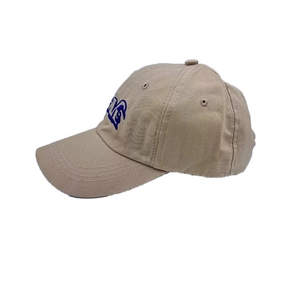 Detail of light khaki cotton baseball cap with navy blue embroidery and curved brim