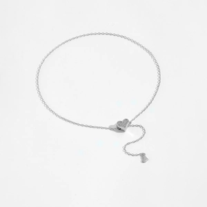 Detailed macro view of S925 silver adjustable slider bracelet with sparkling heart charm
