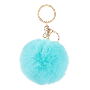 Close-up of a fluffy sky blue plush ball keychain with a polished gold metal clasp
