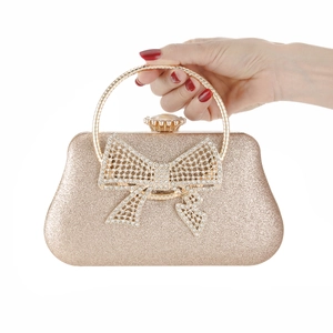 Elegant gold glitter evening clutch bag with crystal rhinestone bow and ring handle