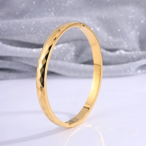 Minimalist gold titanium steel cuff bracelet with textured geometric diamond pattern