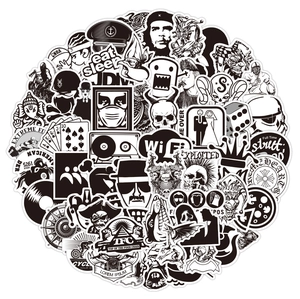 Pile of black and white punk graffiti stickers for luggage featuring diverse urban designs