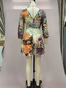 Detail of bohemian patchwork floral print dress with backless V-neck and long sleeves