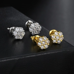 Sparkling gold and silver floral stud earrings set with multiple round crystal diamonds