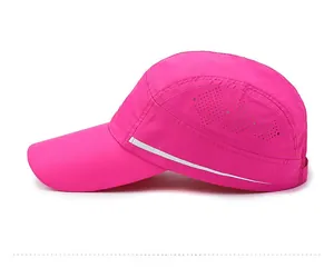 Detail of rose pink sports cap showing laser-cut vents and reflective side stripes