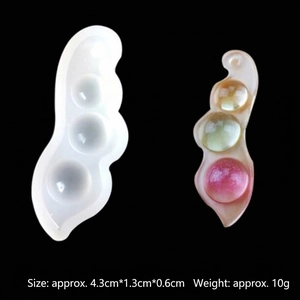 Macro detail of a pea pod silicone resin mold with multi-color crystal earring pendant