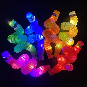 Colorful LED pop tubes glow-in-the-dark sensory stretch toys in various shapes on black