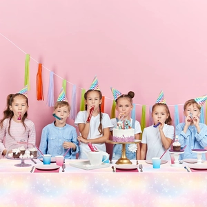 Pink rainbow party set with disposable star tablecloth and hats for girl's birthday