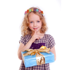 Detail showing a girl wearing a colorful daisy flower headband holding a blue gift box