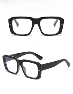 Detail view of thick black tortoiseshell frame showing anti-blue light lens and modern retro style