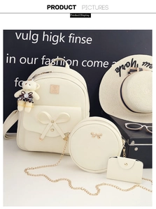 Detailed set of cream leather backpack, chain bag, and pouch with cute bow accents