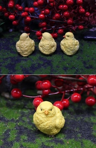 Detail showing various angles of resin miniature yellow chicks for garden micro-landscapes