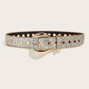 Detail of wide rhinestone belt featuring silver glitter strap and a gold metal buckle