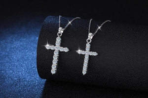 Close-up of elegant S925 sterling silver cross pendants with shimmering moissanite stones