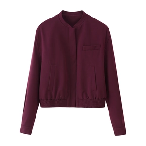 Burgundy bomber jacket for women featuring side pockets and elastic hem on white background