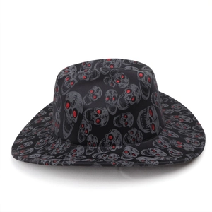 Detailed view of black cowboy hat with grey skull print and red glitter eyes.