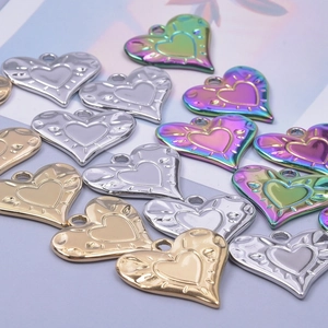 Polished stainless steel heart charms in gold, silver, and iridescent for DIY jewelry