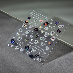 Holographic 3D nail stickers featuring laser butterflies, floral patterns and artistic text