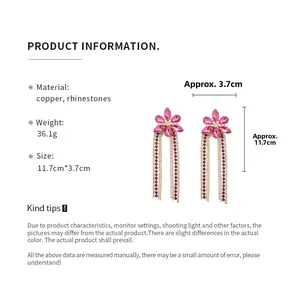 Detailed view of pink flower tassel earrings featuring rhinestones and long fringe