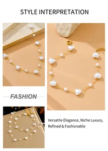 Detail of gold chain necklace with white heart pearls and lobster clasp closure