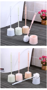 Detail of four colorful plastic toilet brush sets with holders in a bathroom setting