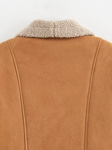 Macro view of camel suede jacket with white lamb wool collar and neat back stitching
