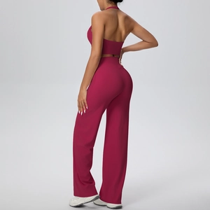 Rear view of magenta halter yoga top and wide-leg trousers showing fabric texture