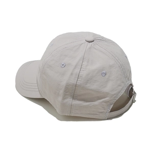 Detail view of the adjustable buckle and lightweight nylon fabric of the grey baseball cap