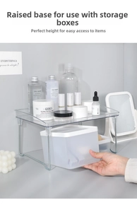 Close-up of a clear acrylic desktop organizer with silver metal legs for storage