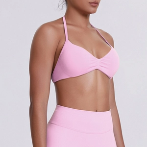 Detailed texture of seamless pink sports bra and high waist leggings yoga set