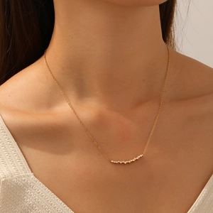 Elegant gold plated stainless steel necklace with sparkling rhinestones on female neck