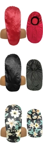 Detail of satin hair bonnets in black, red and floral patterns for long hair care