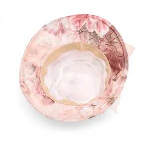 Internal view of floral sun hat showing white breathable mesh lining and beige sweatband