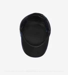 Detail view of winter flat cap interior with thickened ear protection and black thermal lining