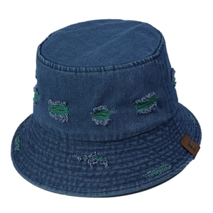 Blue denim bucket hat with green distressed holes and a small brown leather logo patch