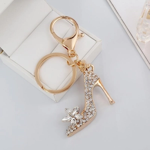 Detailed view of high heel keychain with sparkling rhinestones and golden lobster clasp