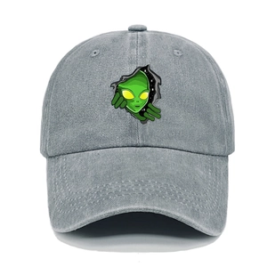 Detail of alien embroidery and vintage washed texture on the light grey cotton baseball cap