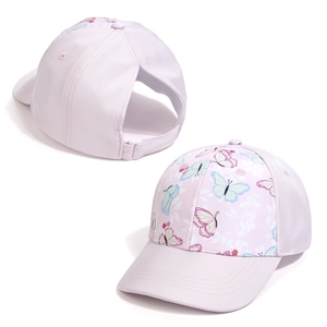 Detail of light pink ponytail baseball cap showing floral butterfly print and rear opening