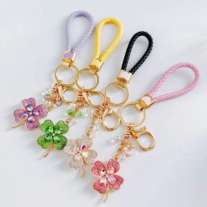 Charming four-leaf clover crystal keychains in four colors with braided leather straps