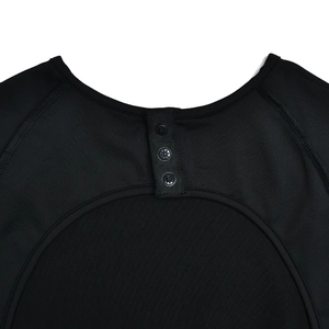 Detail view of black slim fit romper featuring a three-button back neckline placket
