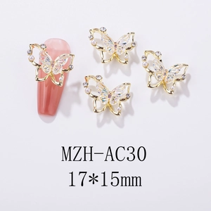 Detail of 17x15mm laser aurora butterfly nail charms with pearls and rhinestones