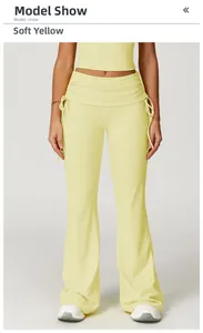Close-up of bud yellow high waist flare yoga pants with drawstring waist detail
