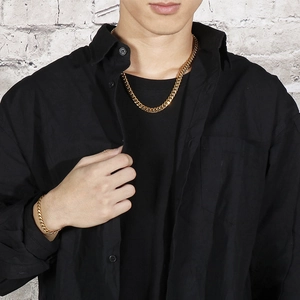 Close-up of a men's 8mm gold Cuban link chain set including necklace and bracelet